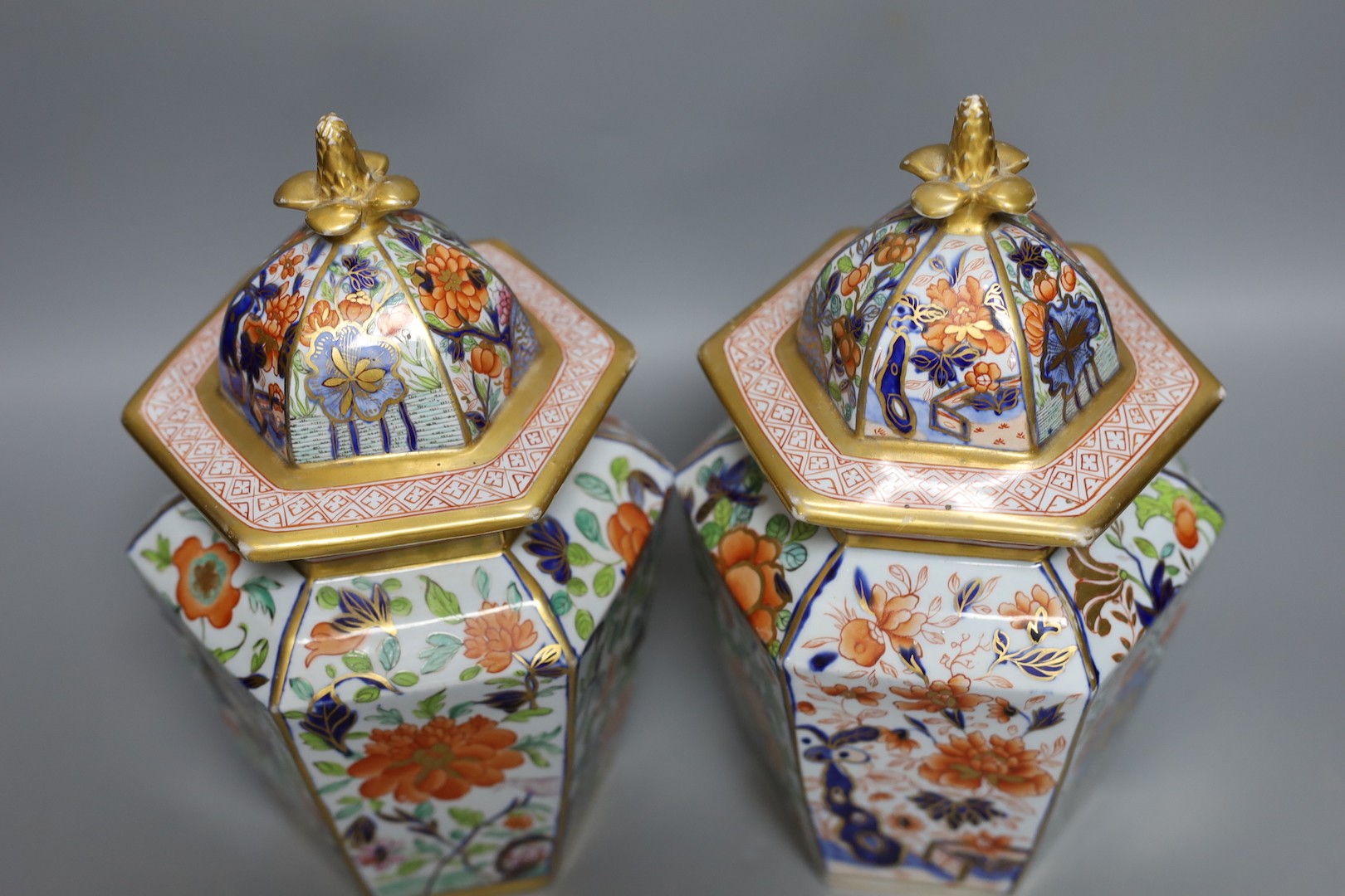 A pair of early 19th century Masons hexagonal ironstone jars and covers 24cm, impressed mark ‘Patent Ironstone China’ to covers only